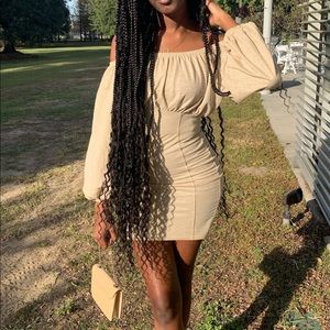 A nude off the shoulder mini dress